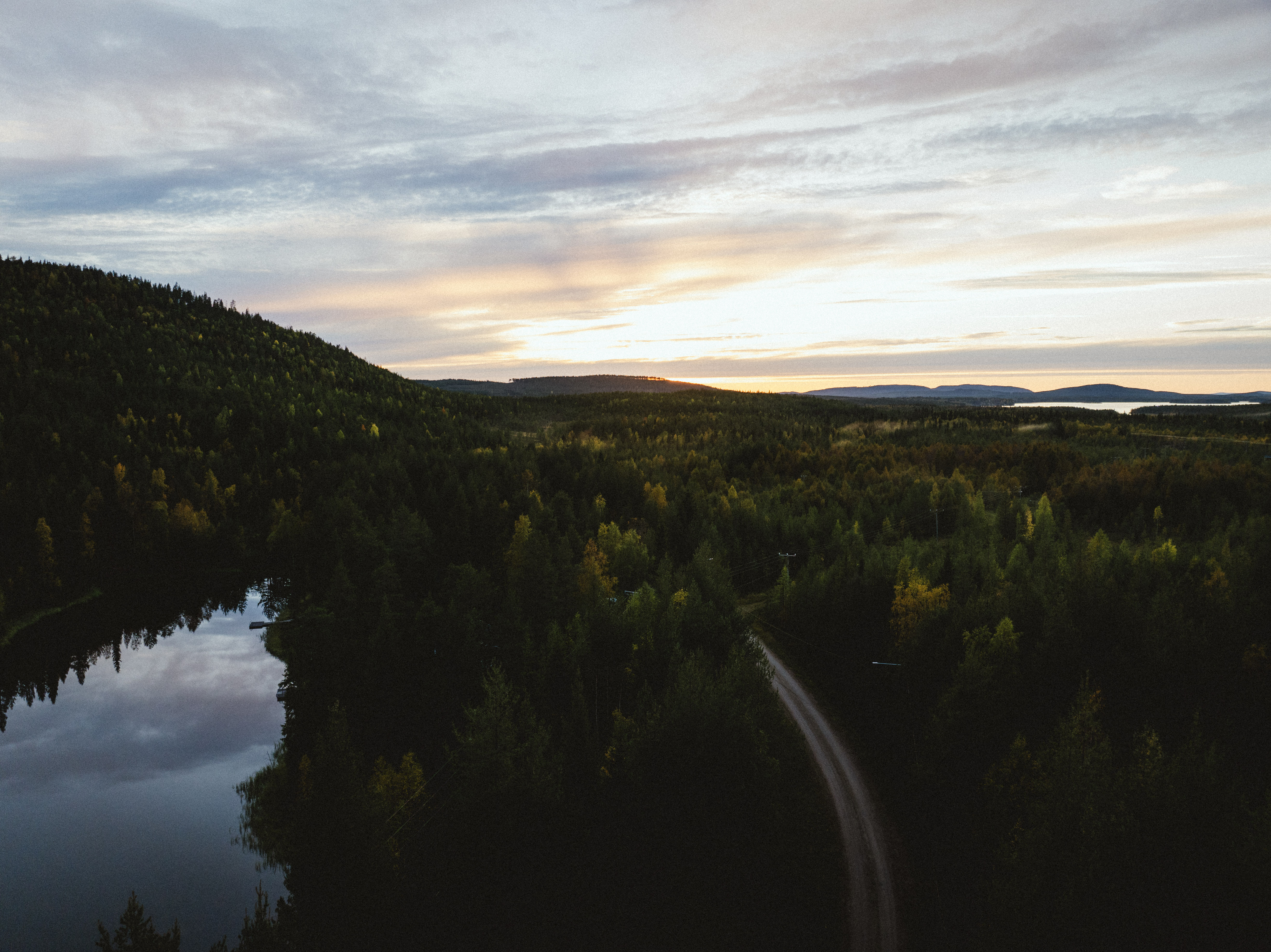 Summer aerial view over forest, lake and road in the Suomu area